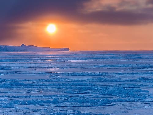 Sunset during winter at the Ilulissat Fjord-located in the Disko Bay in West Greenland Art Print